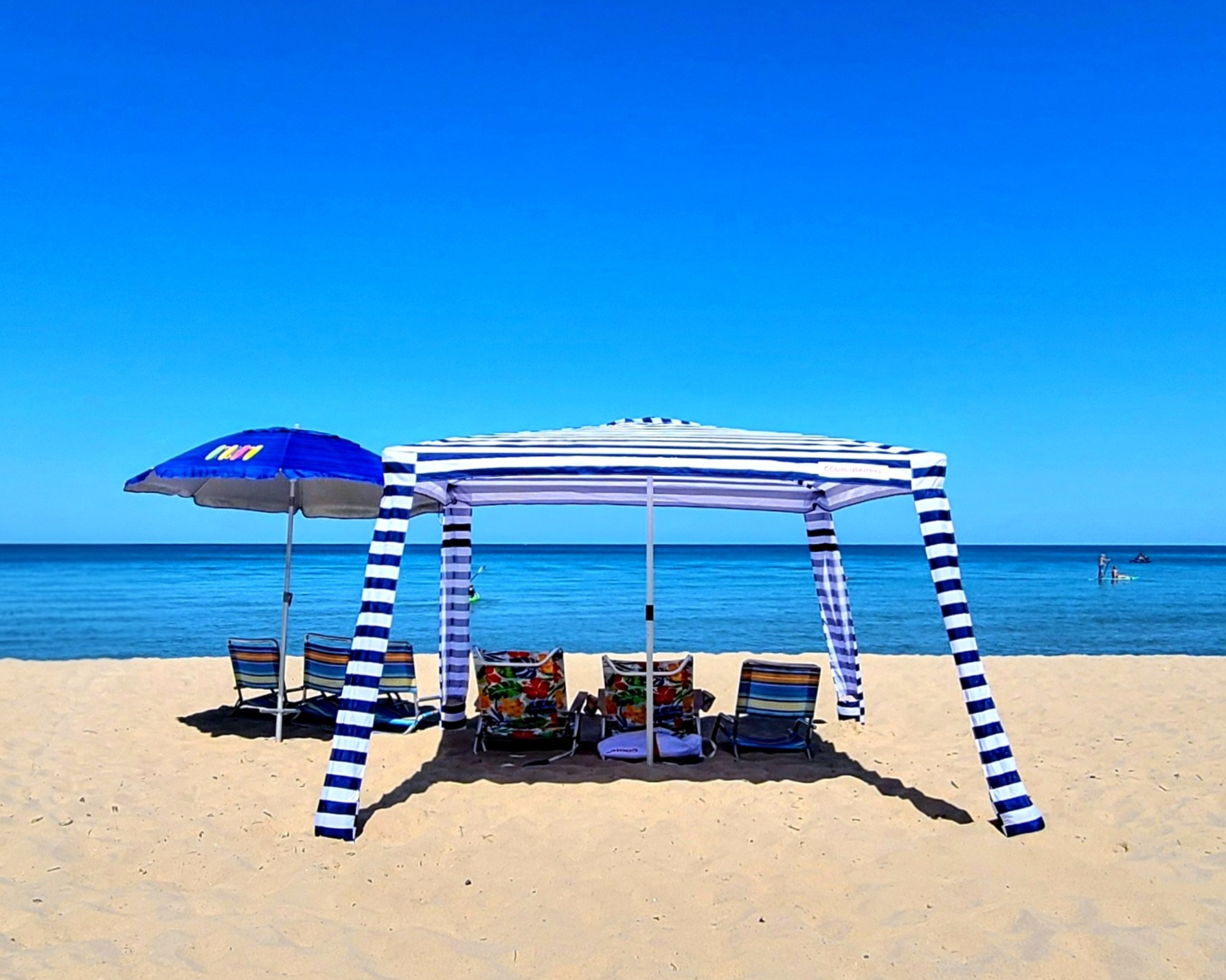 Beach cabana and umbrella on Lake Michigan